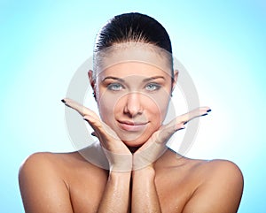 Beautiful woman with water drops on face