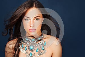 Beautiful woman wearing big glamorous necklace