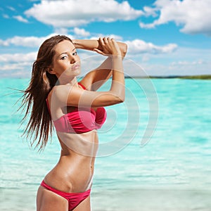 Beautiful woman wearing bikini on beach