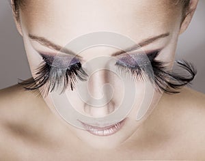 Beautiful woman wearing false eyelashes