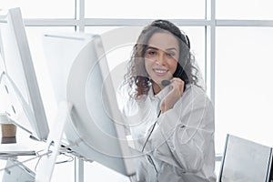 Beautiful woman wearing headsets worker call centre. working customer support service operator.