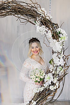 Beautiful woman in wedding dress in photo studio.