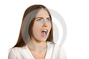 Beautiful woman in white blouse scream on white background