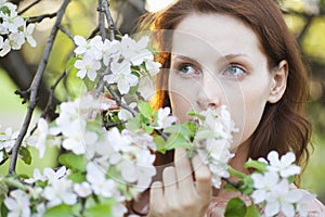 Beautiful Woman With White Flowers Looking Away