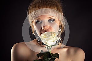 Beautiful woman with white rose