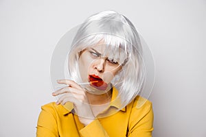 beautiful woman in white wig lollipop fashion