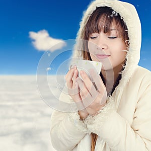 Beautiful Woman with winter anorak and mug