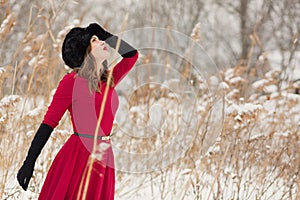 Beautiful woman in winter field