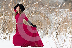 Beautiful woman in winter field