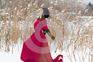 Beautiful woman in winter field