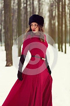 Beautiful woman in winter forest