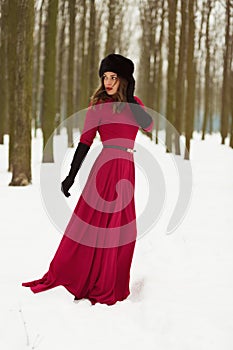 Beautiful woman in winter forest