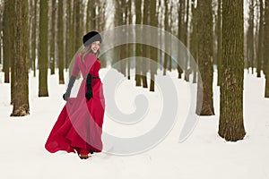 Beautiful woman in winter forest