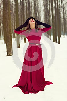 Beautiful woman in winter forest