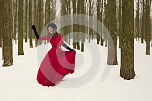 Beautiful woman in winter forest