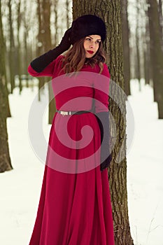 Beautiful woman in winter forest