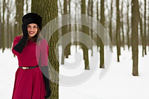 Beautiful woman in winter forest