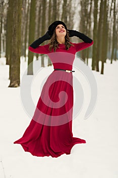 Beautiful woman in winter forest