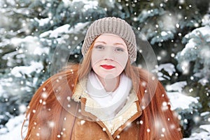 Beautiful woman on winter outdoor, snowy fir trees in forest, long red hair, wearing a sheepskin coat