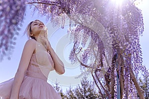 Beautiful woman in wisteria photoshoot portrait background beauty portrait photoshoot