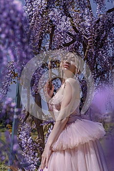 Beautiful woman in wisteria photoshoot portrait background beauty portrait photoshoot