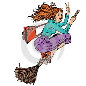 Beautiful woman witch flying on a broom photo