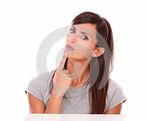 Beautiful woman wondering with her finger on chin