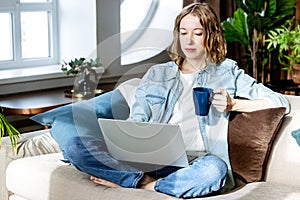 Beautiful woman working on laptop at home. Business meeting online