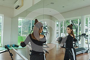 Beautiful woman workout gym in fitness room