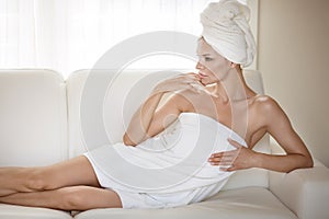 Beautiful woman wrapped in towel.