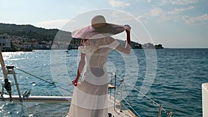 Beautiful woman on a yacht enjoys the journey, Spetses, Greece, Europe