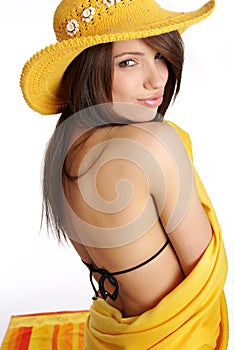 Beautiful woman in yellow hat and bikini
