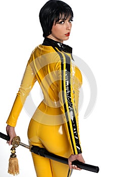 Beautiful woman in yellow latex jump suit