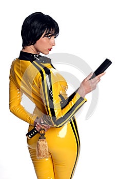 Beautiful woman in yellow latex jump suit