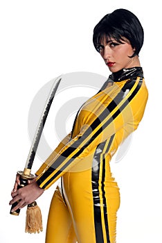 Beautiful woman in yellow latex jump suit