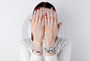 Beautiful womans hands with a pink manicure in minimal style