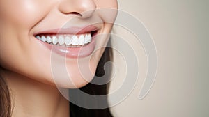 Beautiful womans smile with healthy white, straight teeth close-up on light background with space for text