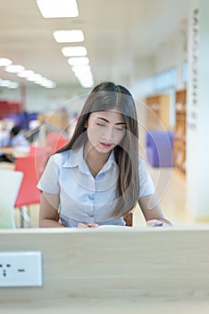 Beautiful women asian university student in library