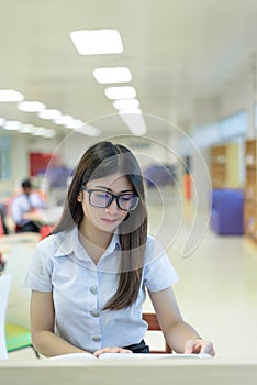 Beautiful women asian university student in library