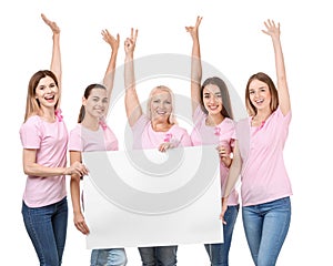 Beautiful women of different ages with pink ribbons holding poster on white background. Breast cancer concept