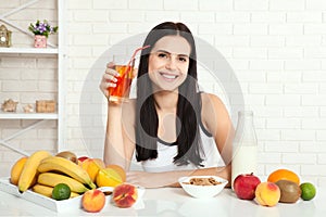 Beautiful women exists with pure skin on her face sitting at a table and eat breakfast. Asian woman eating healthy food at