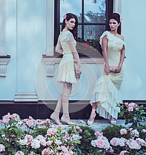 Beautiful women near luxury building facade