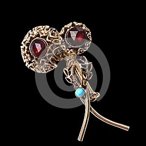 Beautiful women`s vintage gold brooch, with bright red crystals