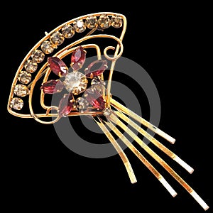 Beautiful women`s vintage gold brooch, with bright red crystals