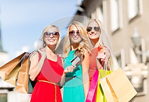 Beautiful women with shopping bags in the ctiy photo