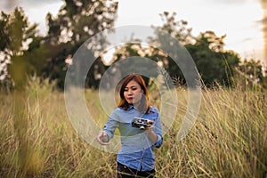 Beautiful women taking pictures in the grass fields