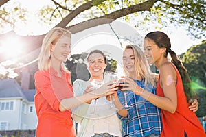 Beautiful women toasting a glasses of red wine