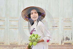 Beautiful women Vietnam with white ao dai dress in old city