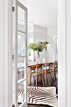 Beautiful wooden dining table in drawing room of luxury house