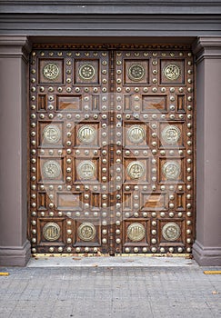 Beautiful wooden door with metal inlays of the General Captaincy of Barcelona, Spain